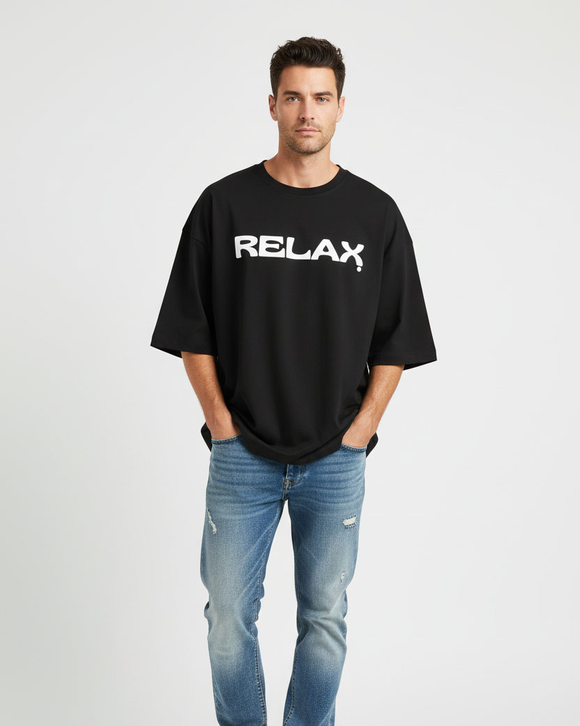 Man wearing a black t-shirt with 'RELAX' text and blue jeans on a white background